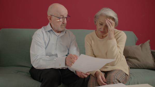 A person and person looking at a piece of paperAI-generated content may be incorrect. A person and person looking at a piece of paperAI-generated content may be incorrect.